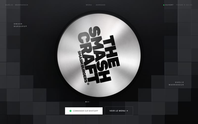Portada de thesmashcraft.ma en escritorio: logotipo en un disco de acero cepillado sobre fondo negro, estado de apertura y botón de pedido por WhatsApp.